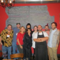 International Food Bloggers with chefs at The Blind Pig, photo by Christine Willmsen